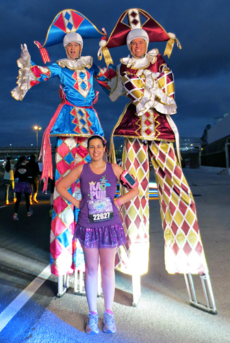 Meeting Mardi Gras Stilt Walkers at rundisney princess half marathon 10k at Disney World